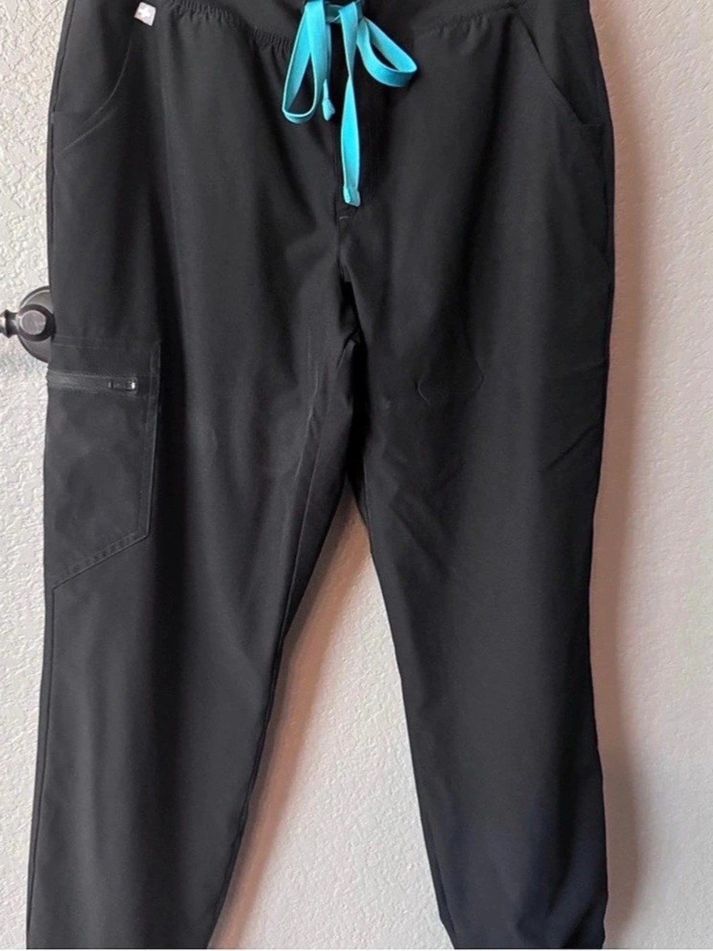 Figs Free-X Black Jogger Scrub Pants with Teal Drawstring.